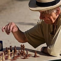 Man playing chess (SOURCE: Wikimedia.org)