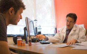 Alzheimer's doctor advising patient on prevention