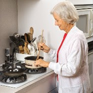 Senior lady cooking in the kitchen