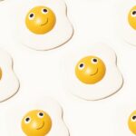 a group of eggs with happy faces drawn on them