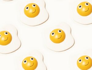 a group of eggs with happy faces drawn on them