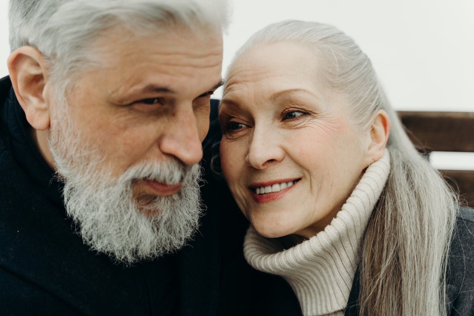 Elderly Man with Dementia and His Wife Smiling Together