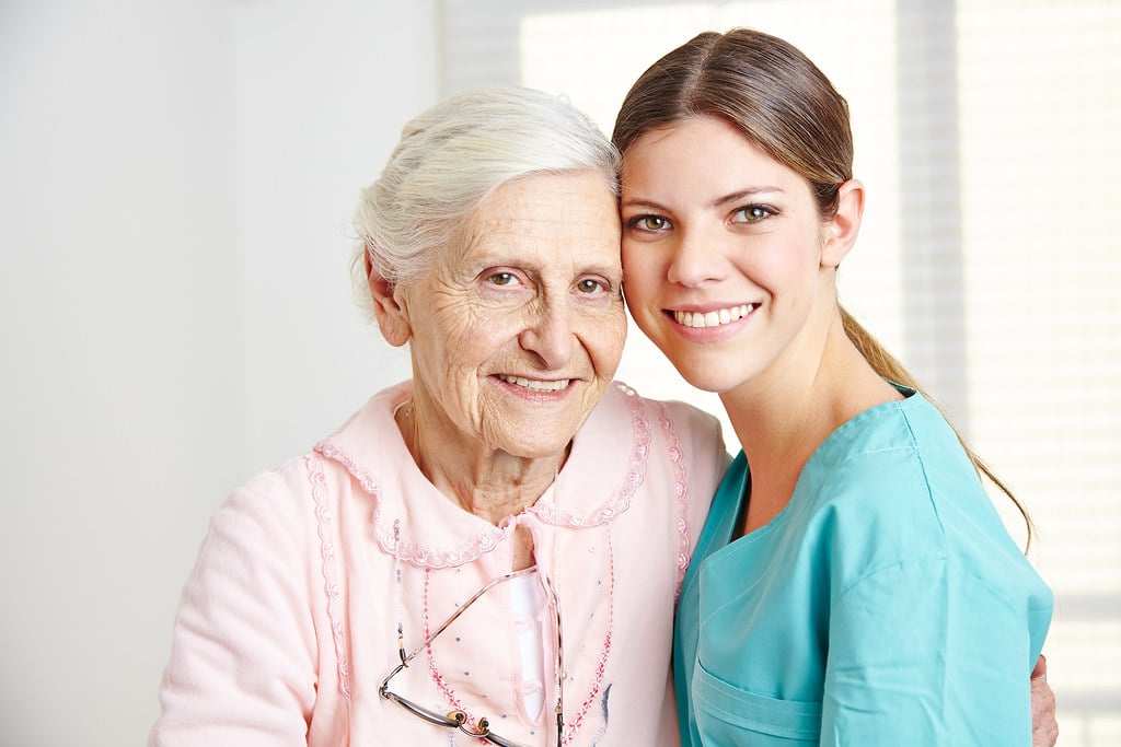 Elder with nurse in hospital
